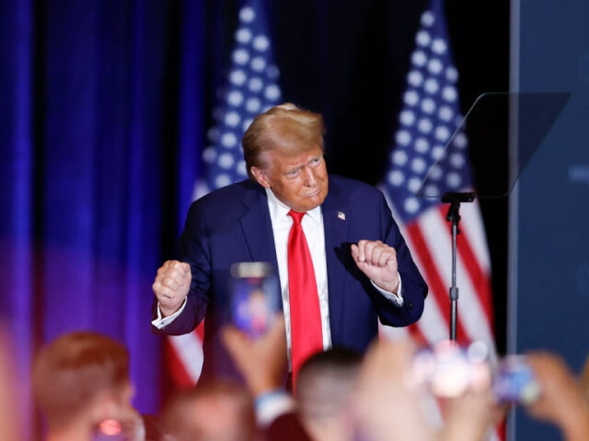 Republican presidential nominee former President Donald Trump dances after speaking at a c