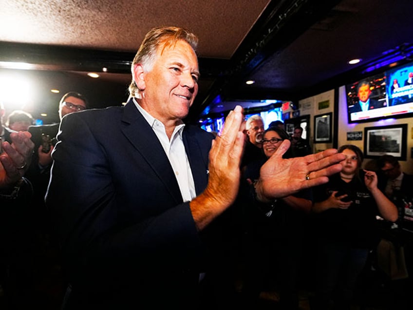 Former U.S. Rep. and Republican candidate for Michigan Senate Mike Rogers prepares to address supporters at a post election gathering, Tuesday, Aug. 6, 2024, in Lake Orion, Mich. (AP Photo/Carlos Osorio)