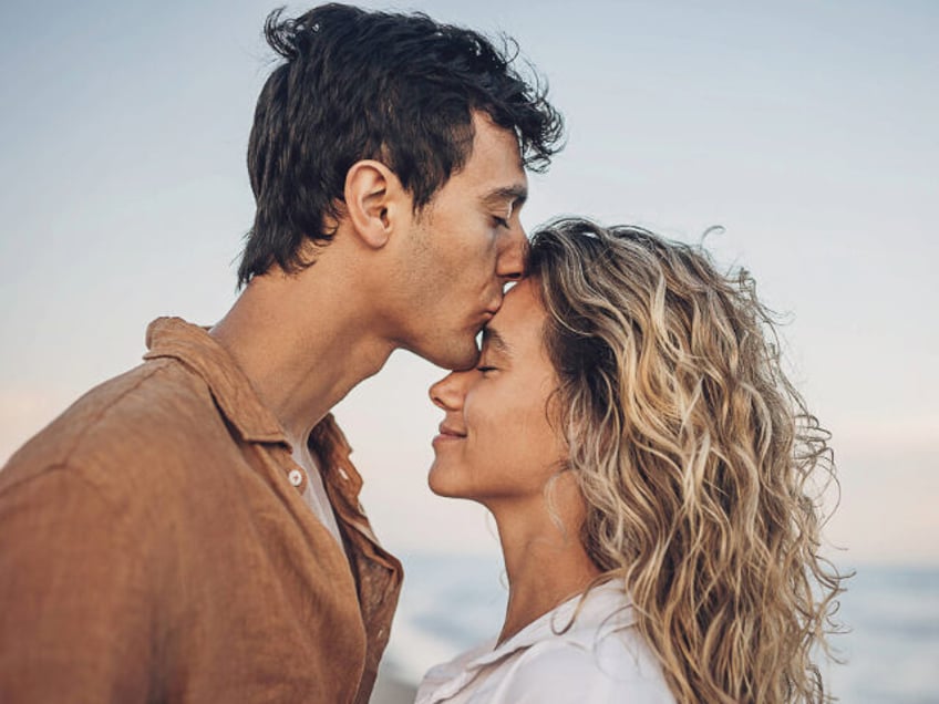 Man kissing his woman - stock photo