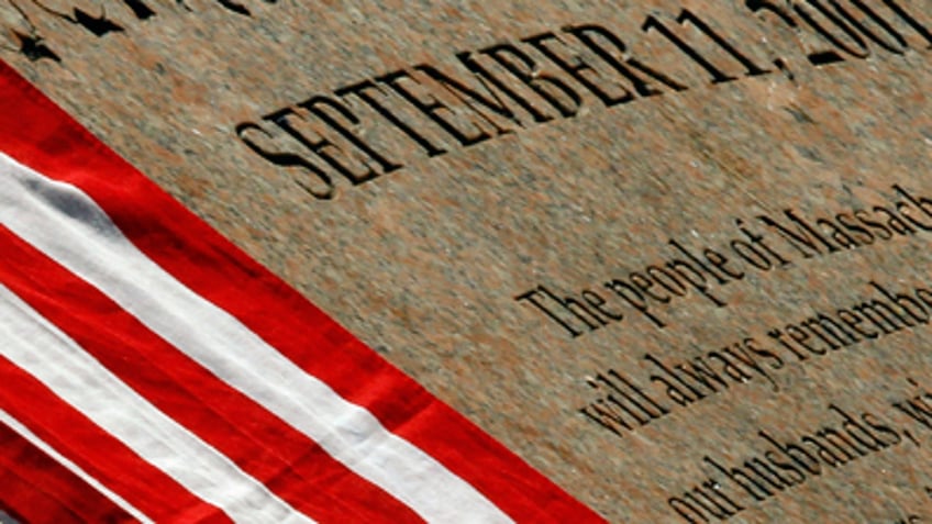 U.S. flag rests on the memorial to Massachusetts victims of the attacks of September 11, 2001 in Boston