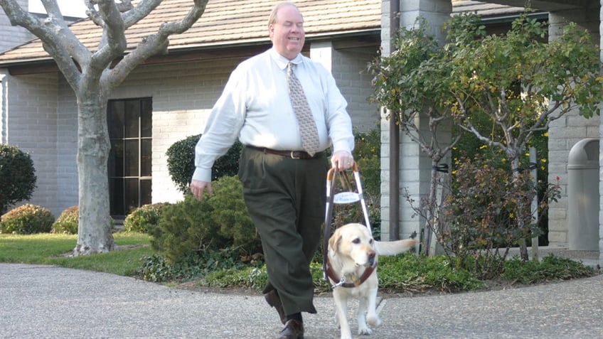 Michael Hingson with his guide dog Roselle