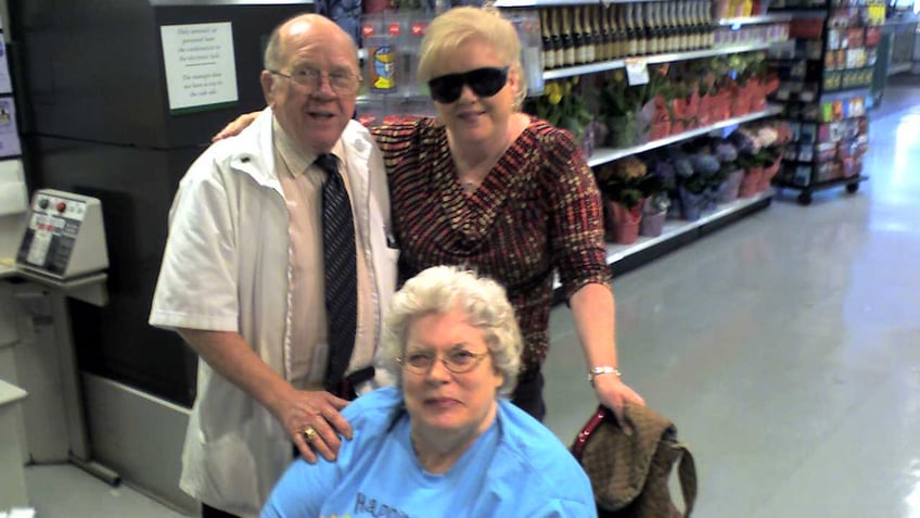 Barbara Mabee Abel with a man in a white coat and her sister wearing a blue shirt