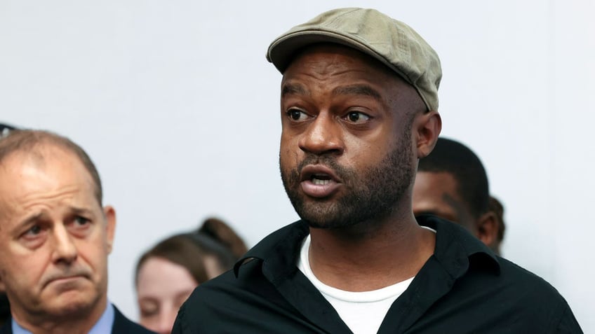 Jeffery Christian, right, speaks at a press conference in Chicago