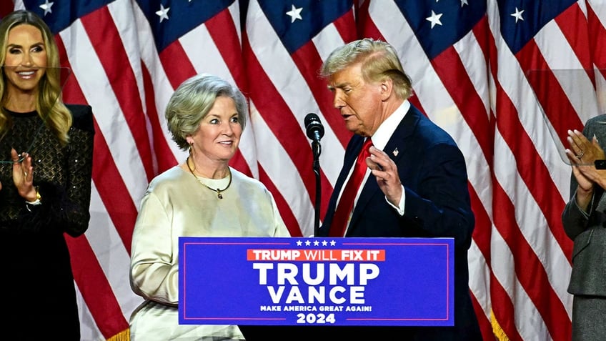 Donald Trump greets his campaign manager Susie Wiles (L) during an election night event at the West Palm Beach Convention Center in West Palm Beach, Florida, on Nov. 6, 2024. Republican former president Donald Trump closed in on a new term in the White House early November 6, 2024, just needing a handful of electoral votes to defeat Democratic Vice President Kamala Harris.