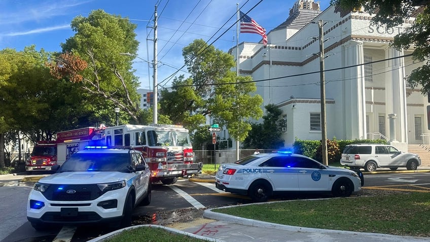 police and fire truck at scene of fire