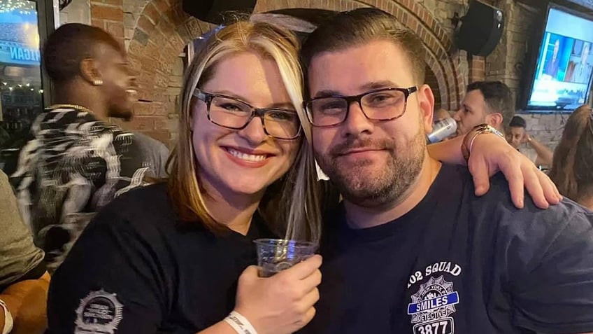 Carl and Emilia Rennhack wearing NYPD T-shirts 