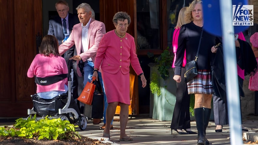 Barbara Clark, mother of Suzanne Simpson, departs her funeral at First Presbyterian Church