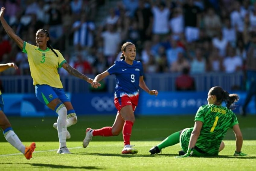 Mallory Swanson scores for the United States against Brazil in the Olympic women's footbal