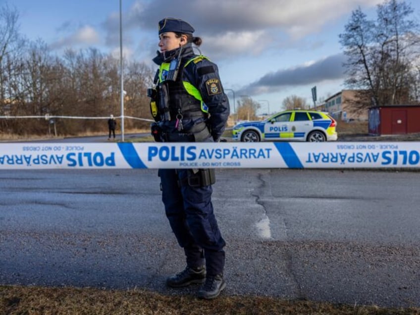 OREBRO, SWEDEN - FEBRUARY 5: Police officers stand behind the cordoned-off area at the cri
