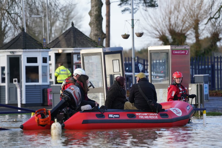 Northamptonshire Fire and rescue service rescue people from houseboats at the Billing Aquadrome in Northampton after the pathway to land was blocked due to rising water caused by Storm Henk. A severe flood alert, meaning danger to life, was in place for the River Nene in Northampton, which warned of deep and fast-flowing water at the Billing Aquadrome holiday park and nearby business parks. Picture date: Wednesday January 3, 2024. (Photo by Jacob King/PA Images via Getty Images)