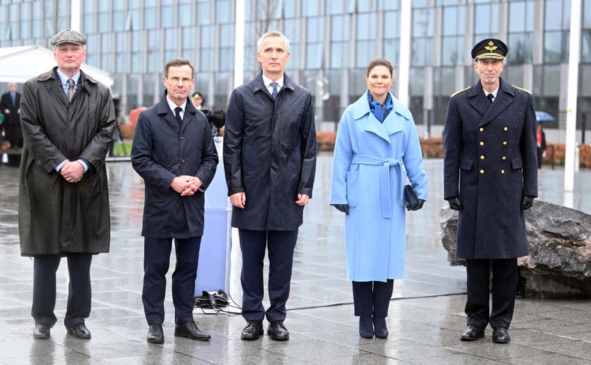 swedish flag raised at nato headquarters for first time