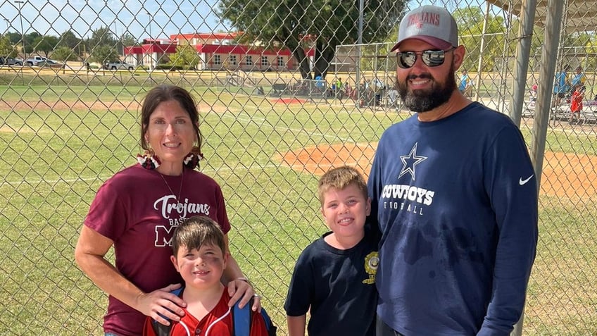 The Maynard family wearing baseball uniforms