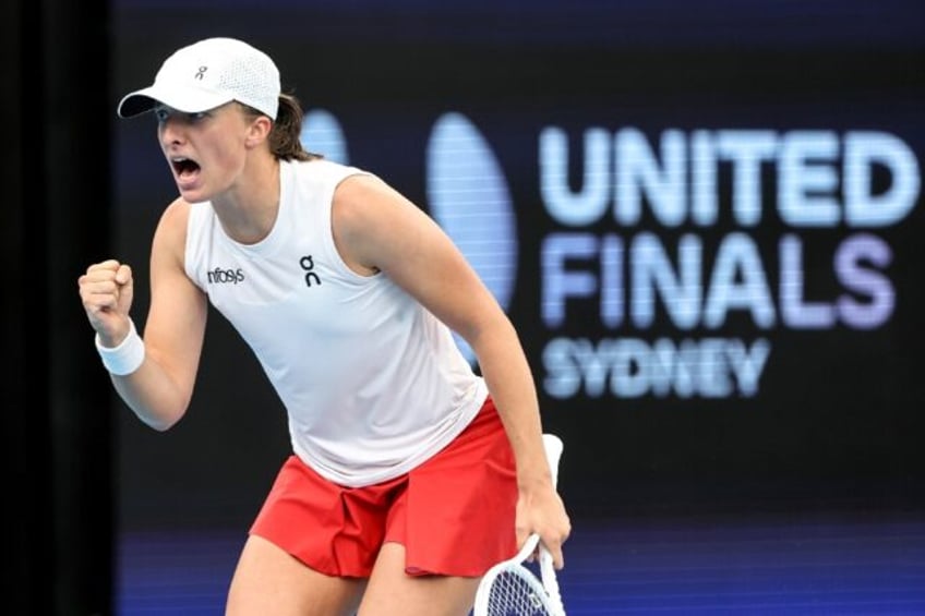 Poland's Iga Swiatek reacts during her singles win over France's Caroline Garcia at the United Cup