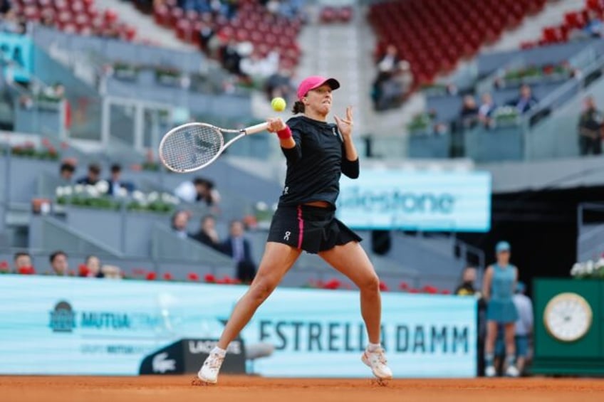 Poland's Iga Swiatek cruised through to the Madrid Open third round as she bids to win the