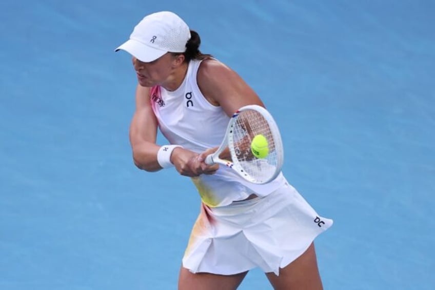 Poland's Iga Swiatek hits a return against Germany's Eva Lys