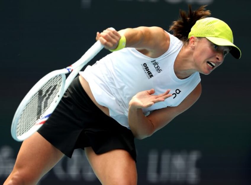 Iga Swiatek reached the last 16 at the Miami Open with a win over Elise Mertens.