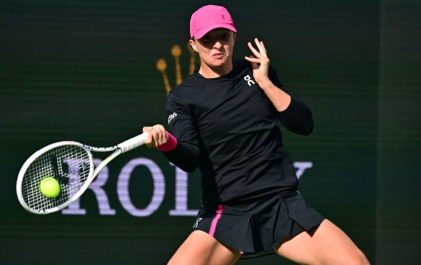 World number one Iga Swiatek belts a forehand on the way to her semi-final victory over Ma