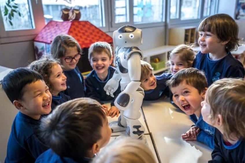 Nao, nao... Swiss children in a Lausanne creche have some fun with their new robot friend,