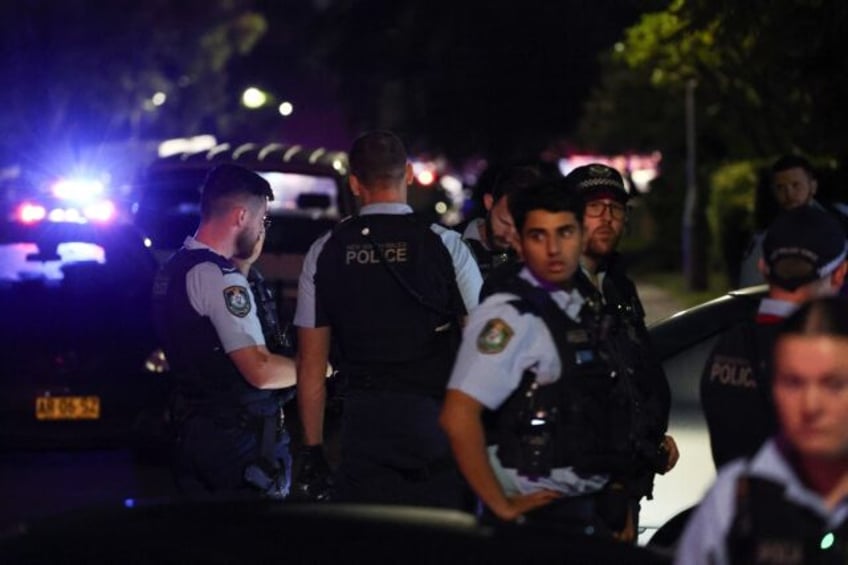 Police gather outside the Christ the Good Shepherd Church in Sydney's western suburb of Wa