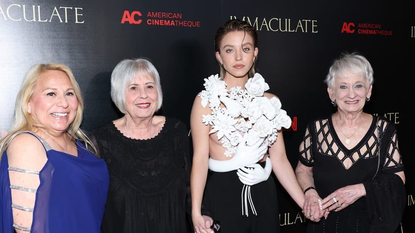 sydney sweeney posing with grandmothers at the LA premiere of immaculate