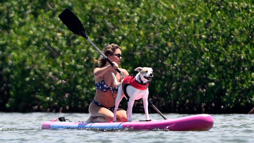 Sweeney and her dog took a ride on the paddle board together.