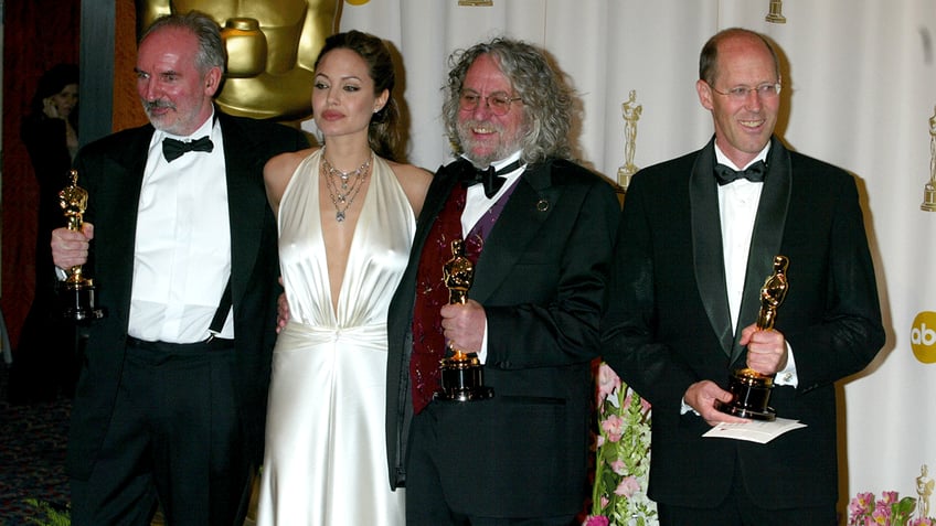 Angelina Jolie with winners of Achievement in Art Direction at 2004 Oscars