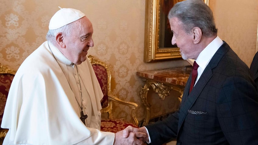 sylvester stallone and pope francis jokingly face off in vatican city