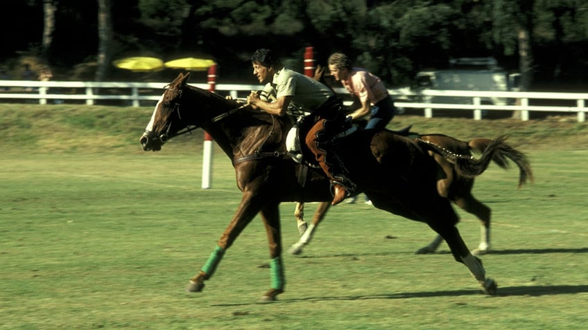 Sylvester Stallone riding a horse