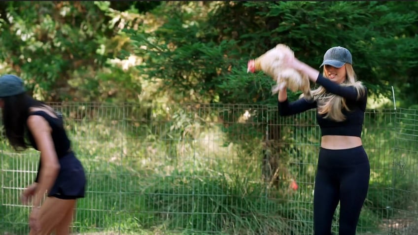 Sophia Stallone holding a chicken