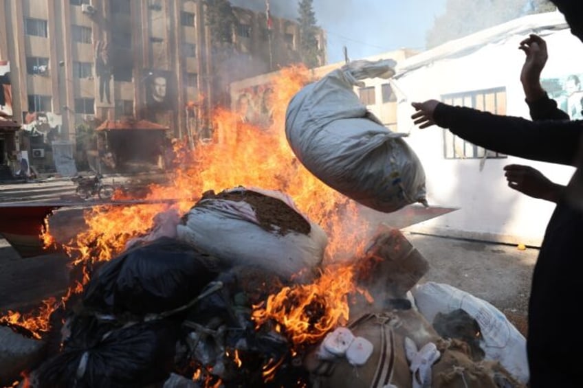 Syria's new authorities burn a cache of drugs at a facility formerly belonging to the secu