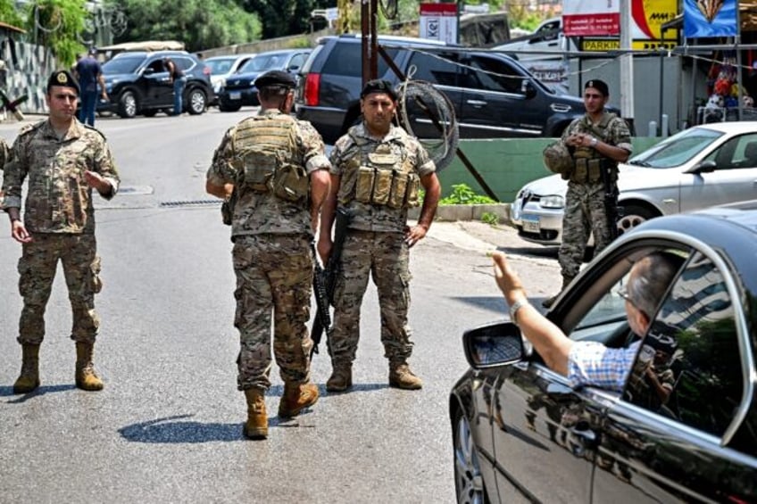 Lebanese troops turn back motorists as they close off access to the area around the US emb