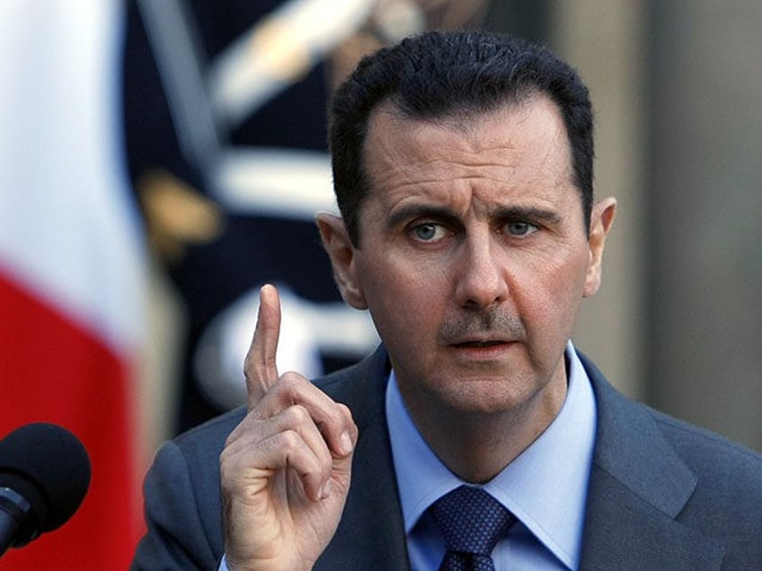 Syria President Bashar al-Assad addresses reporters following his meeting with French Pres