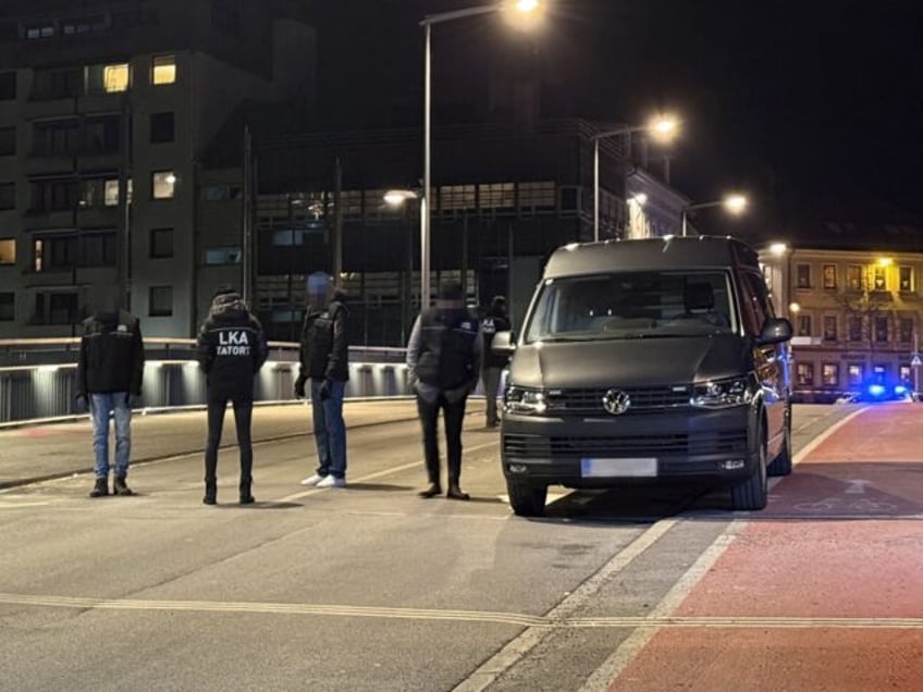 Officers of the Austrian State Criminal Police are seen near a cordoned off area after a k