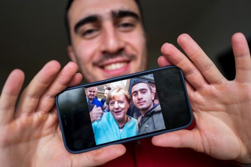 Syrian refugee Anas Modamani took a selfie with Germany's then chancellor Angela Merkel