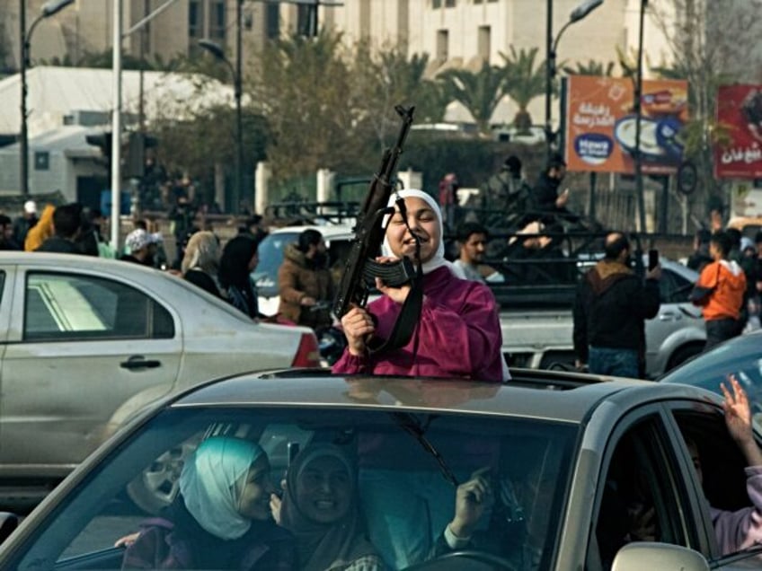 DAMASCUS, SYRIA - DECEMBER 8: Syrians in the capital Damascus celebrate as sixty-one years