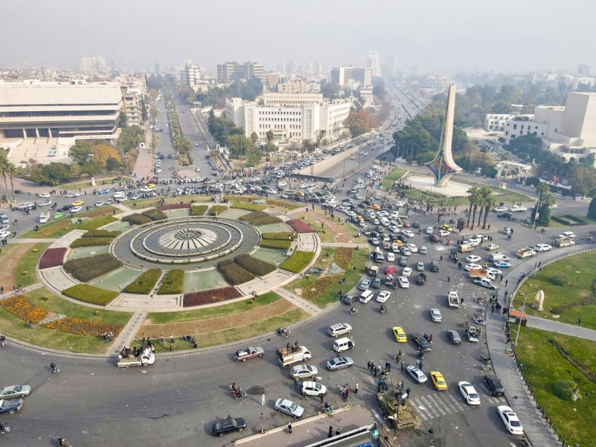 syrians cheer end of assad family rule with gunfire mass street rallies