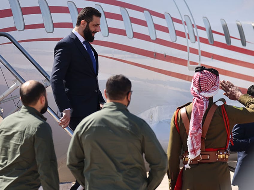 Jordan's King Abdullah II welcomes Syrian President Ahmad al-Sharaa at Marka airport on Fe