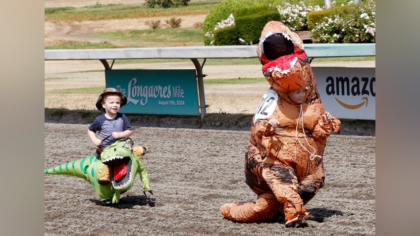 Two "little dinos" compete in the T-Rex World Championships at Emerald Downs on August 17.