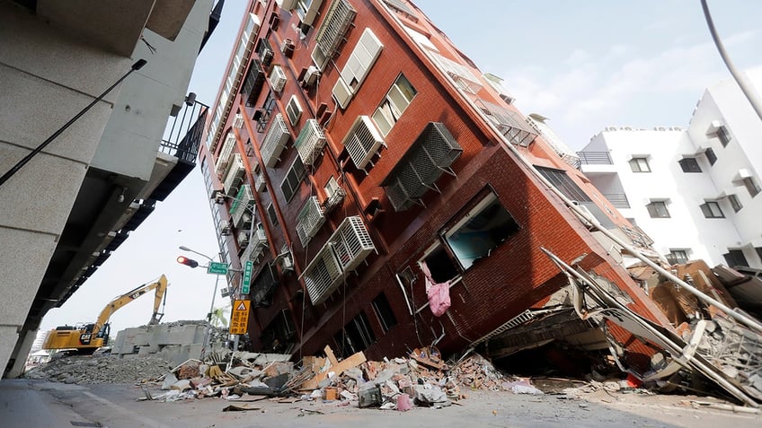 A building tilts after a powerful earthquake struck Taiwan
