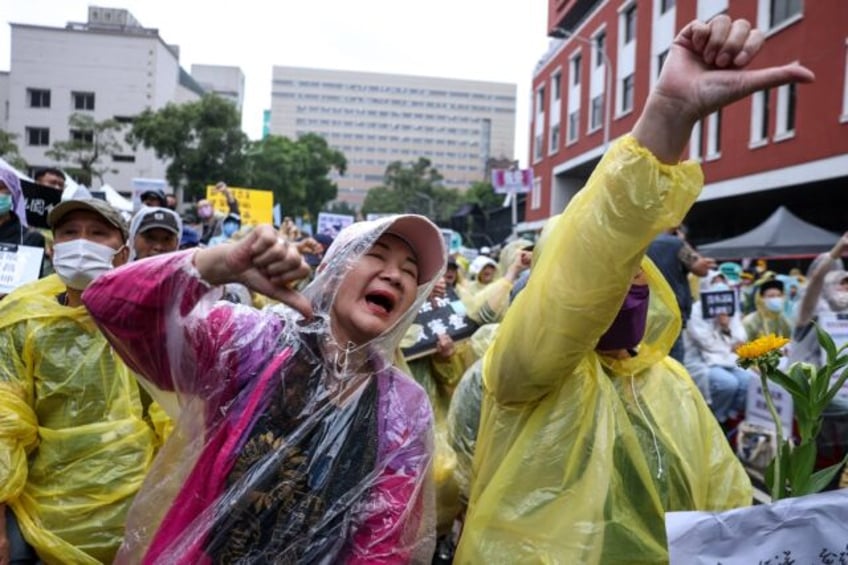 Taiwan's parliament on Tuesday passed a package of controversial bills to expand its power