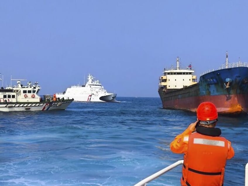 In this photo released by the Taiwan Coast Guard, Taiwanese Coast Guard vessels prepare to