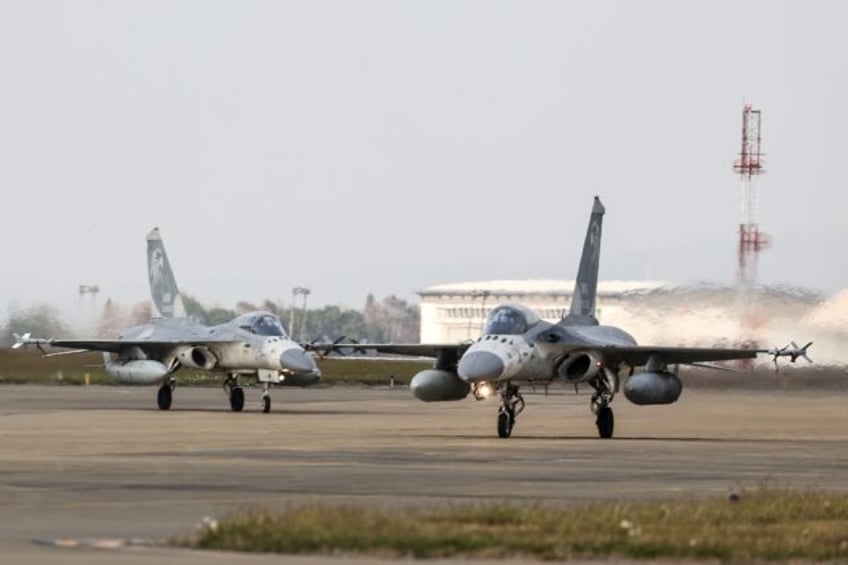 Taiwanese air force Indigenous Defense Fighter aircraft taxi for take-off during a scrambl