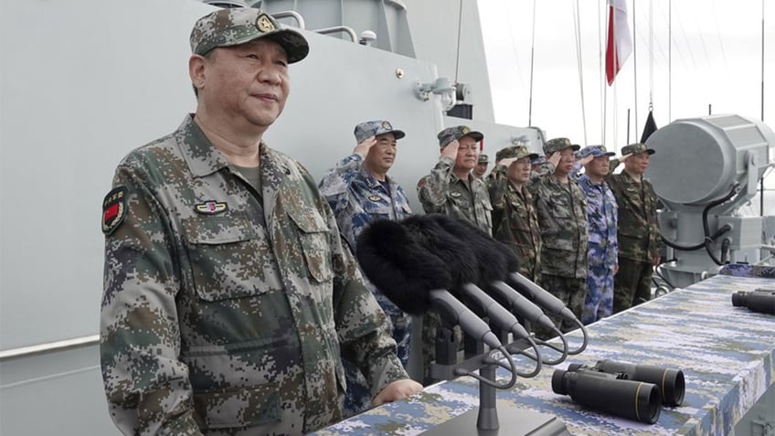 Xi Jinping tours battleship in Chinese military uniform