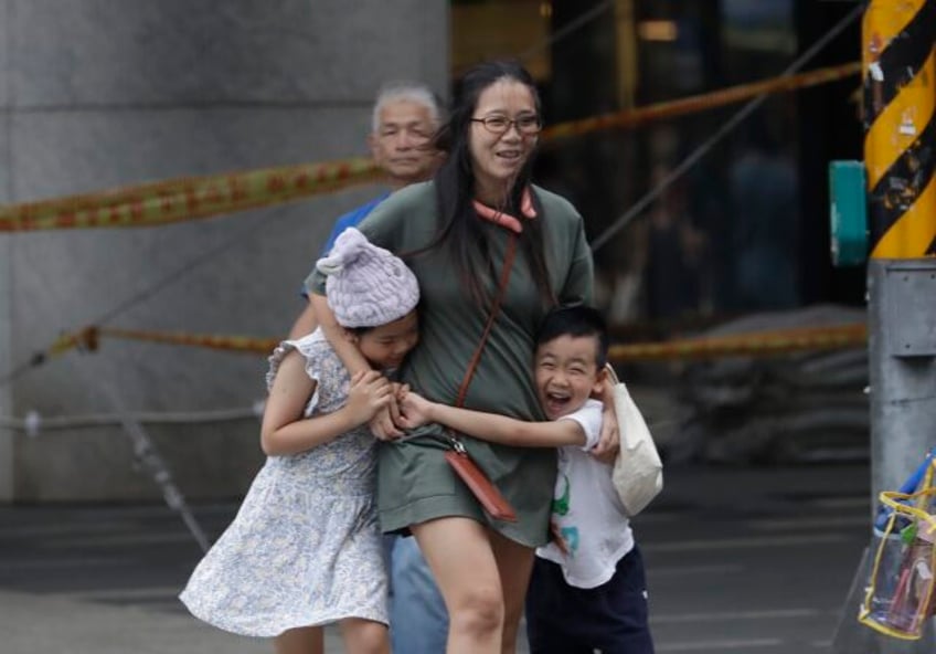 taiwan suspends work transport and classes as typhoon haikui slams into the island