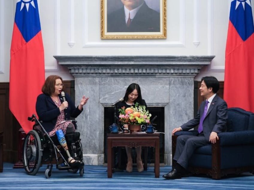 Taiwan's President Lai Ching-te (R) meets US Senator Tammy Duckworth (L) at the Presidenti