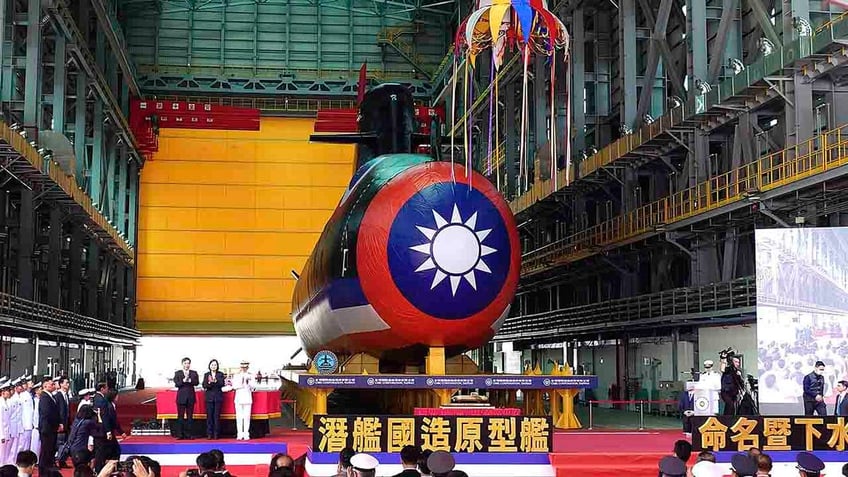 taiwan unveils first domestically made submarine as tensions with china grow