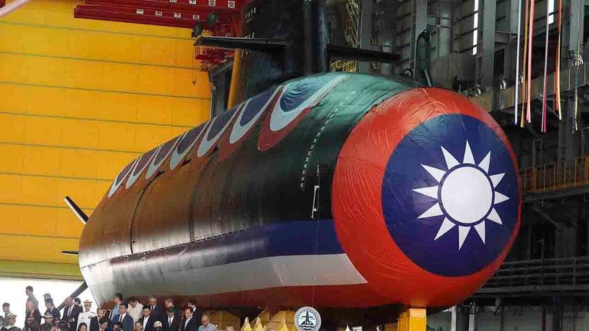 taiwan unveils first domestically made submarine as tensions with china grow