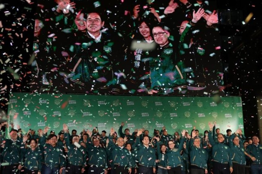 Taiwan's President-elect Lai Ching-te (centre L) and his running mate Hsiao Bi-khim (centre R) attend a rally outside the headquarters of the Democratic Progressive Party (DPP) in Taipei on January 13, 2024, after winning the presidential election