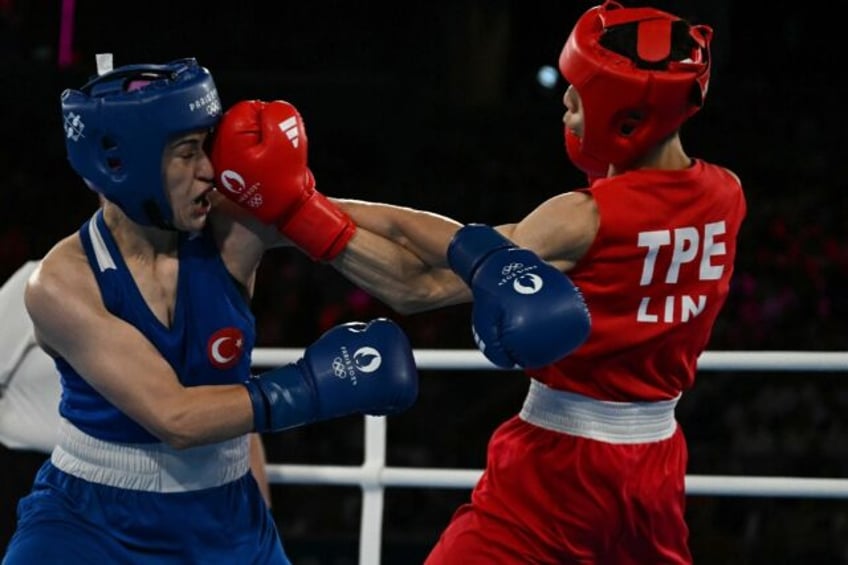 Taiwan's Lin Yu-ting (in red) defeats Turkey's Esra Yildiz Kahraman to make the 57kg final