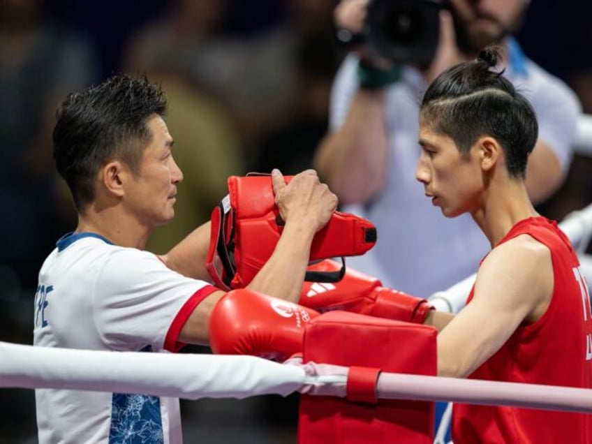 PARIS, FRANCE - AUGUST 2: Lin Yu-ting (red) of Taiwan (TPE), competes against Sitora Turdi